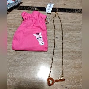 Pink zebra soaks jewelry